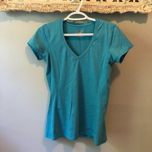 Under Armour shortsleeved blue gym shirt.